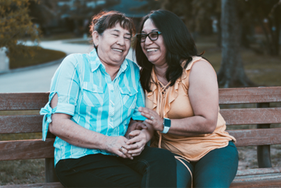 Two women sitting on bench