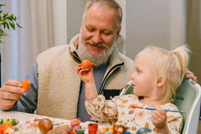 Grandpa painting with granddaughter