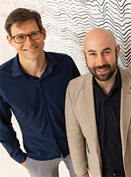 Neurosurgeon David Brandman, M.D., Ph.D., and neuroscientist Sergey Stavisky, Ph.D.