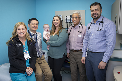 Lillian Hodgkins with family and her care team