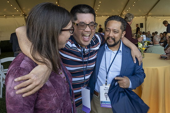 Class of 2005 alumni laughing.