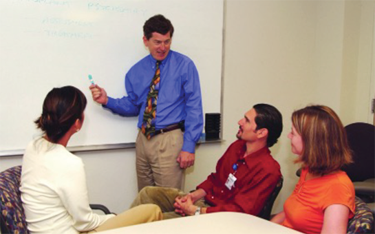 Mark Servis teaching students