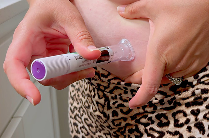 Woman administering GLP-1-based therapy