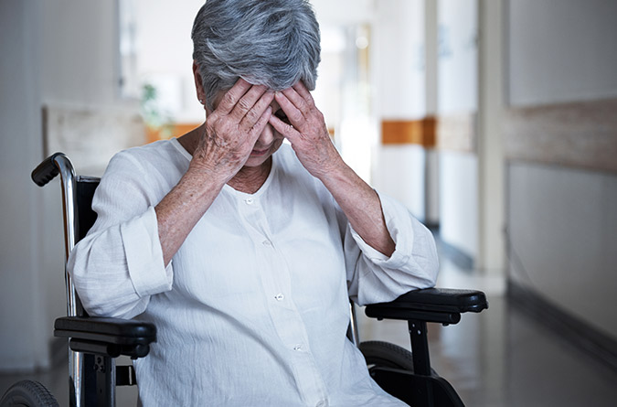 Elderly woman in wheelchair