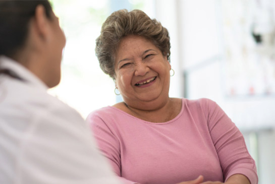 Older female patient and a doctor.