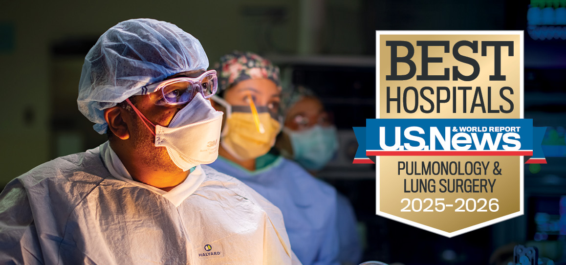 Thoracic surgeon David Cooke in operating room with US News and World Report Best Hospitals Pulmonology and Lung Surgery 2025-2026 badge overlaid.