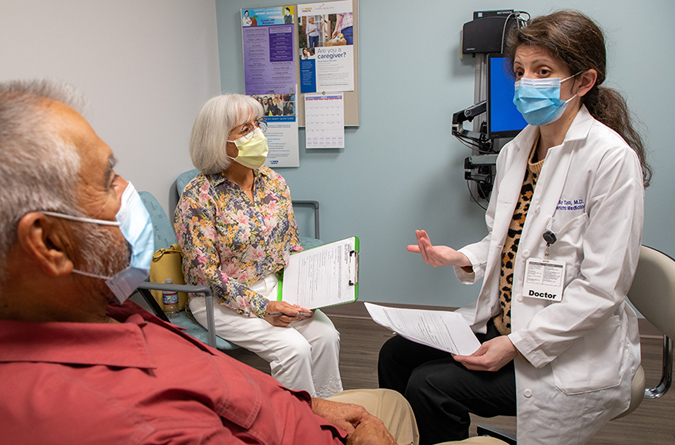 Healthcare worker assisting a patient.