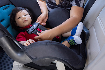 Infant in a rear-facing car seat.