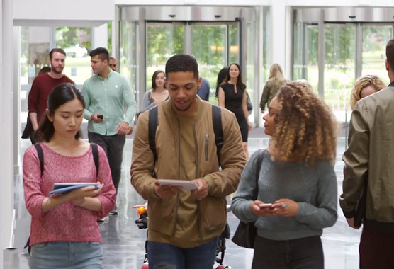 Students walking in a hallway.