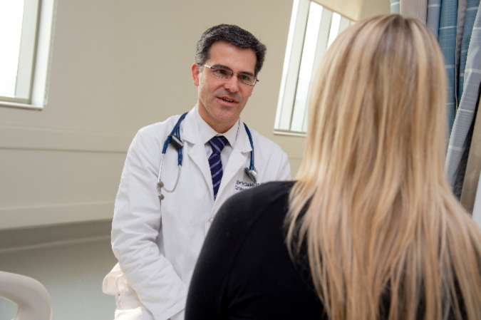 Dr. Cadeiras meeting with patient.