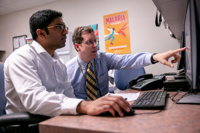 doctor walking in to exam room.