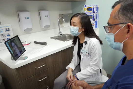 doctors talking to patient on video chat