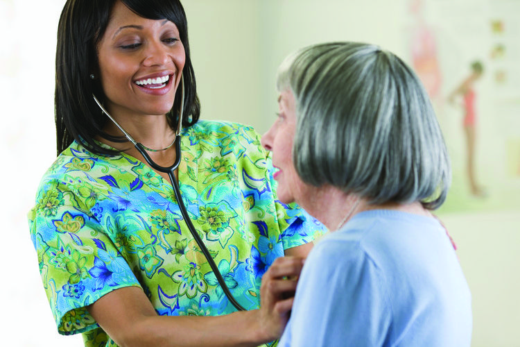 nurse helping patient