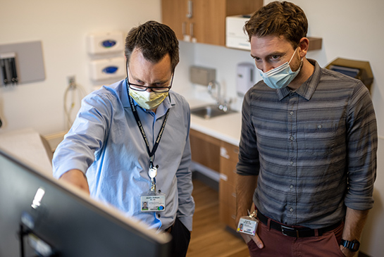 Doctors reviewing a patients information. 