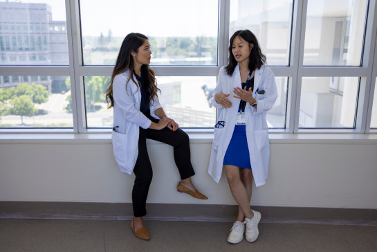 Two hospitalists talking at the main hospital at UC Davis Health