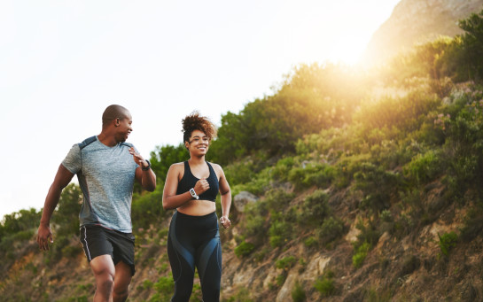 Two people walking for exercise outdoors.