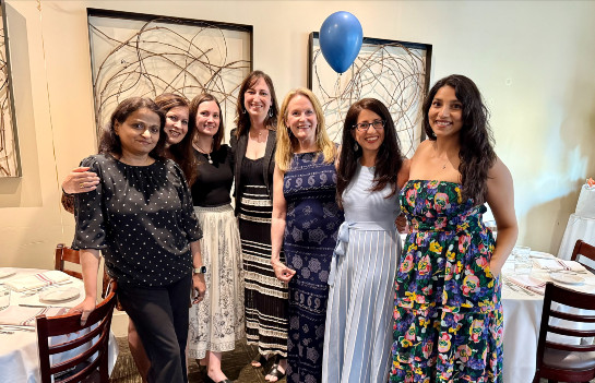 Female fllows and faculty celebrate fellowship graduation
