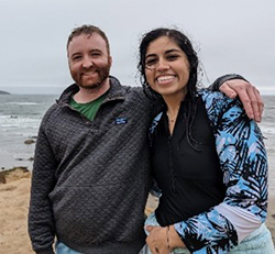 A couple standing on a beach