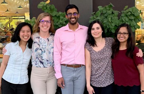 five smiling resident doctors out on the town