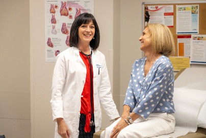 Amparo Villablanca and patient have light-hearted conversation