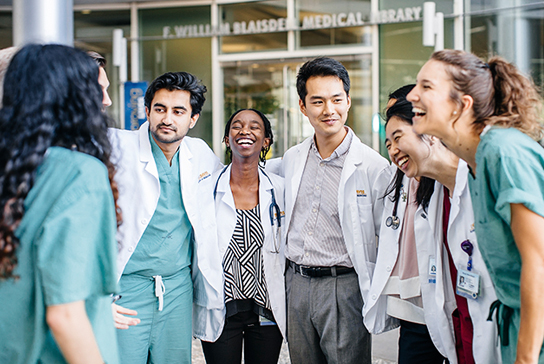 UC Davis Medical students standing outside the education building