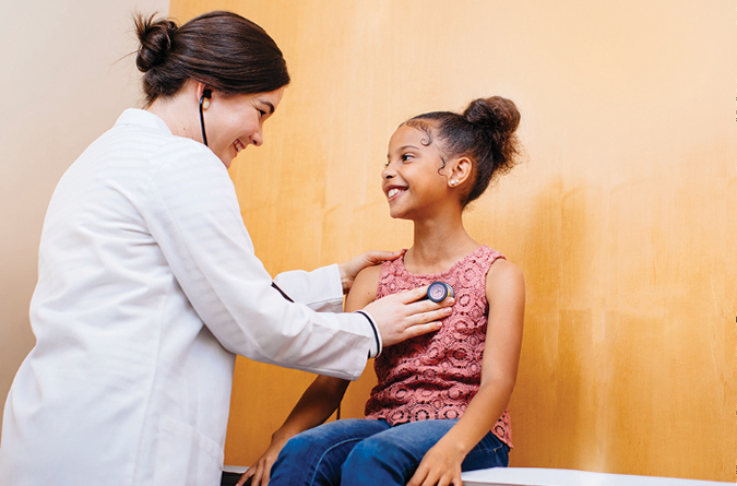 Doctor examining a young patient.