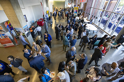 Overhead shot of a crowd of people in a large conference space