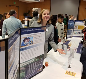 Researcher showing a poster presentation