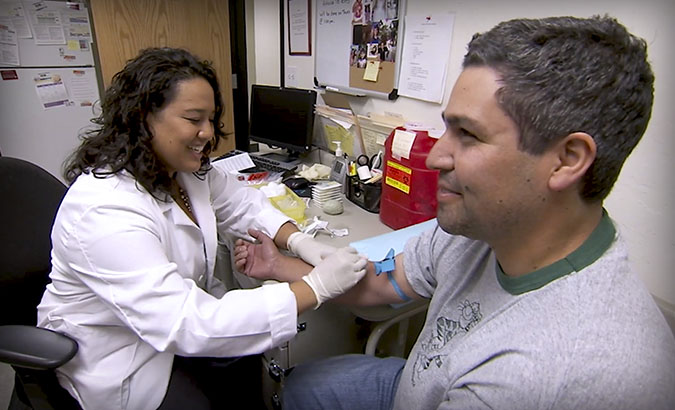 Medical student providing patient care in a community clinic office