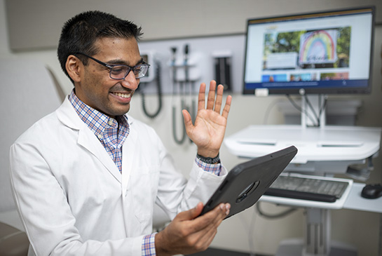 Dr. Vinu Ninan providing telehealth services