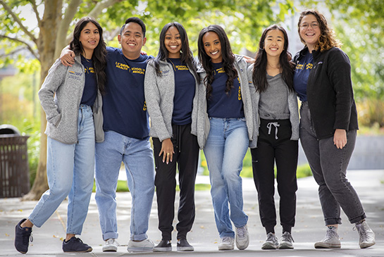 A group of medical students standing outside of UC Davis School of Medicine