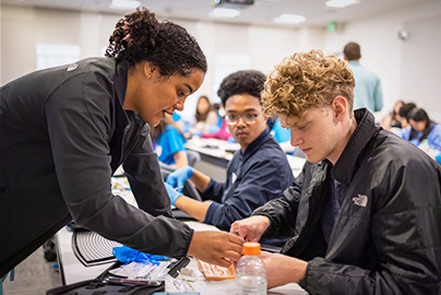 AvenueM participants learning about medical careers