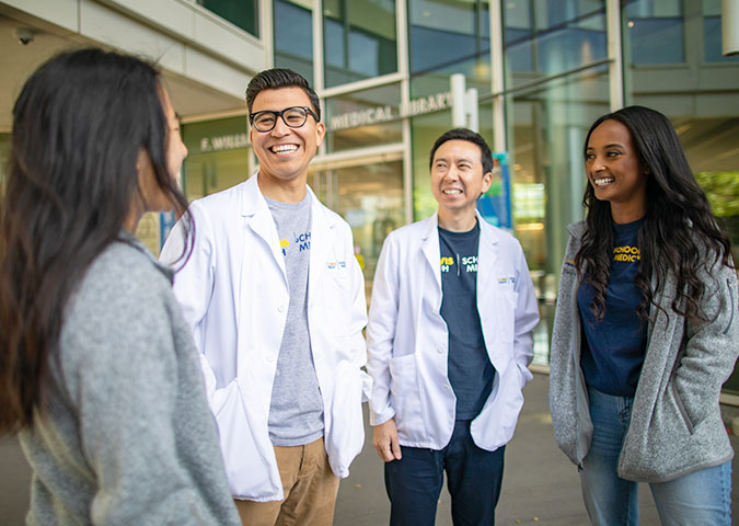 UC Davis School of Medicine students in front of education building