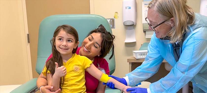 MIND Institute Staff Helping a Child with a Procedure