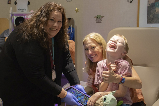 Family working with staff