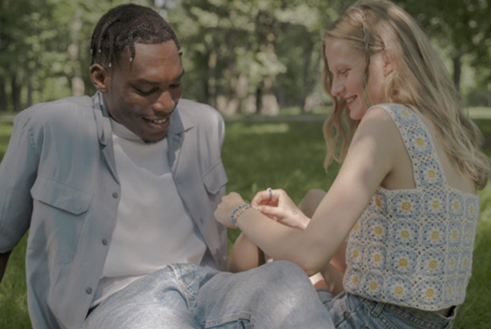 boy and a girl talking in a park