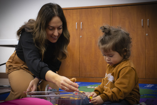 child working with an instructor