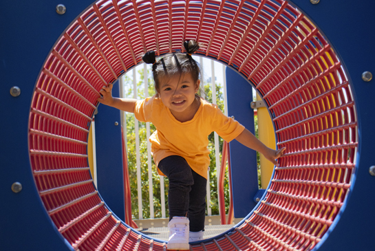 Girl playing on the MIND Playground