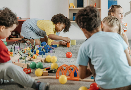 children playing inside with toys