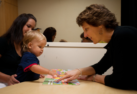 researcher working with a family