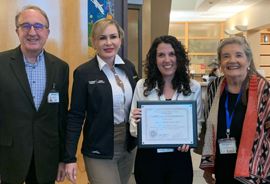 graduate of ITPND with her mentors