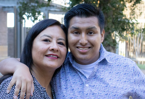 Mom and son outside posing for picture