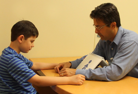 Researcher working with a child