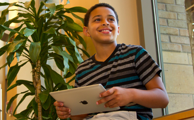 child working on a laptop