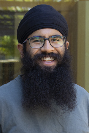 Deepinder Nagra smiling in a professional headshot