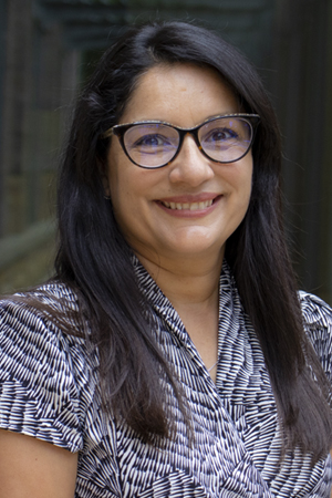 Glenda M Espinal, B.S. smiling in a professional headshot