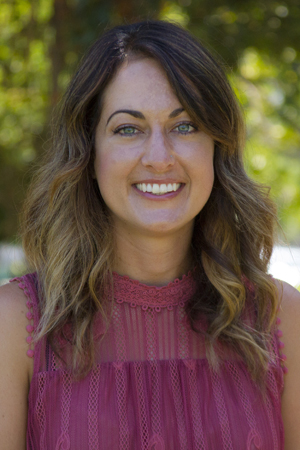 Mel Mello, Psy.D., BCBA smiling in a professional headshot