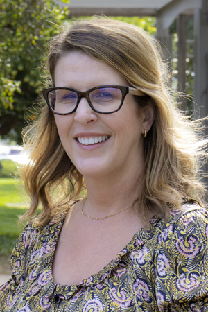Marie Rocha, Ph.D., BCBA-D smiling in a professional headshot