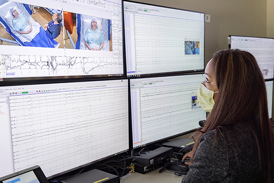 lady observing eeg reading