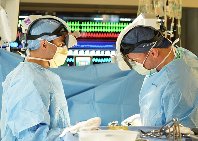 Neurosurgeons using augmented reality on a surgery